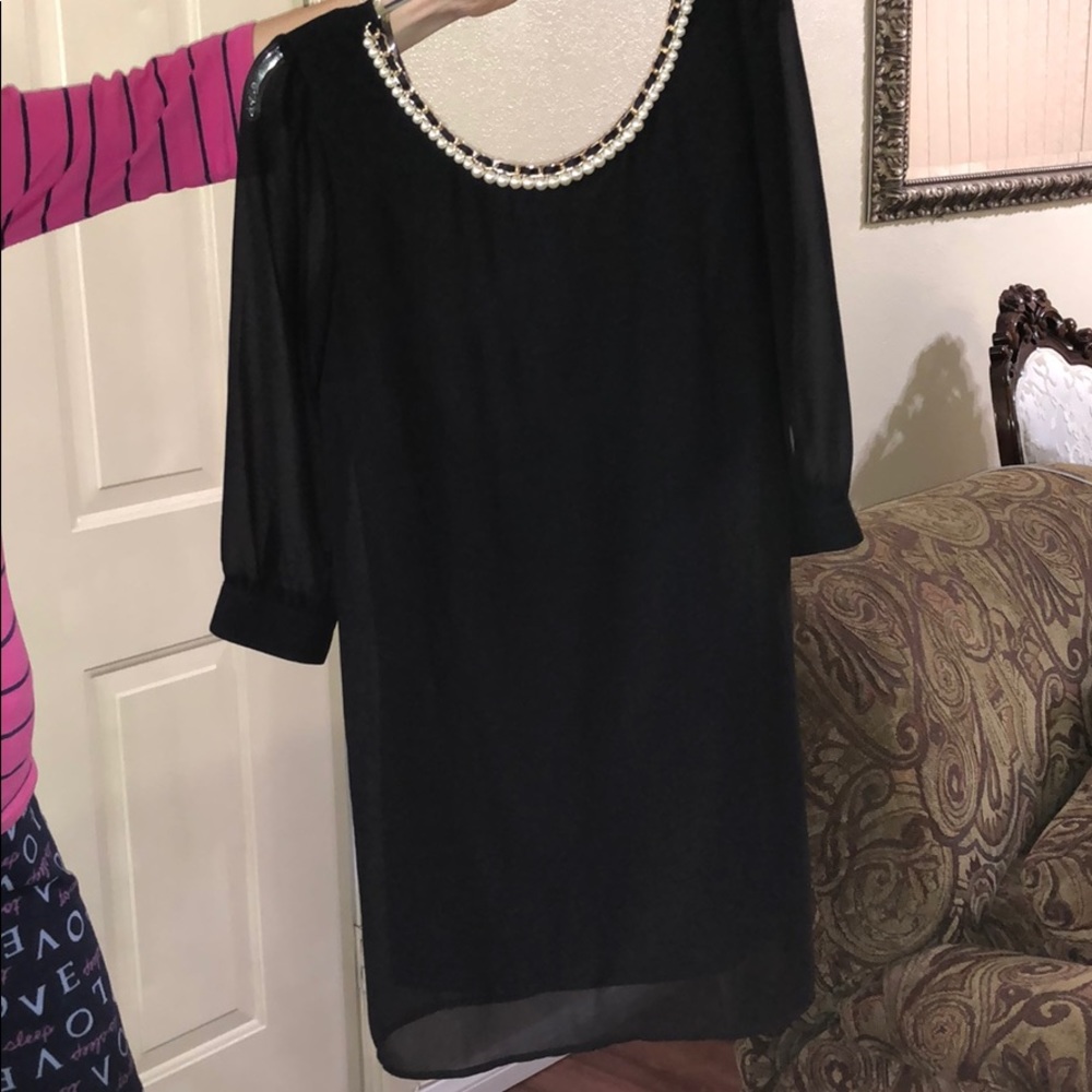 Black shift dress with detailing